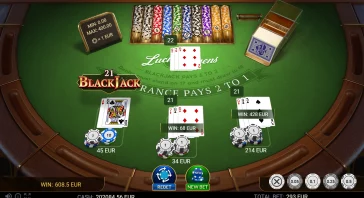 Online blackjack table with multiple hands, chips, and bets on a green felt—showing wins and totals throughout the table.