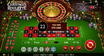 Christmas-themed online roulette table with a glowing central wheel, festive decorations, and a banner that says 'YOU WIN 375 USD'