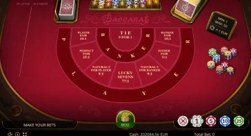 Baccarat table layout with betting zones labeled A-N-K-E-Y and 'Tie 9 for 1' at center; chips on right side and deck of cards top-left.