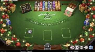 Christmas-themed blackjack table with stacked chips and a 'DEAL' button visible at the bottom center