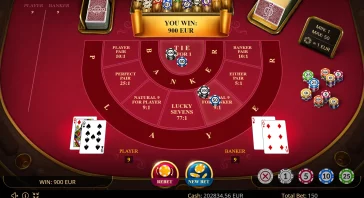 Casino table with 'You Win: 900 EUR' banner, chips and cards around a red betting layout.